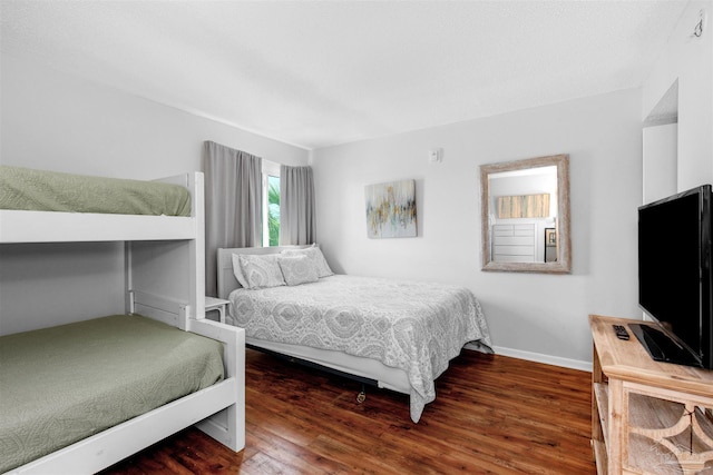 bedroom featuring dark wood-type flooring