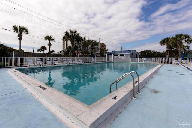 view of swimming pool featuring a patio area