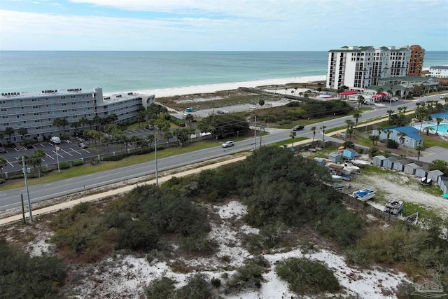 bird's eye view featuring a water view and a view of the beach