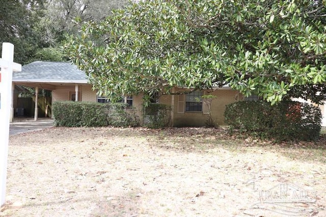 exterior space featuring a carport