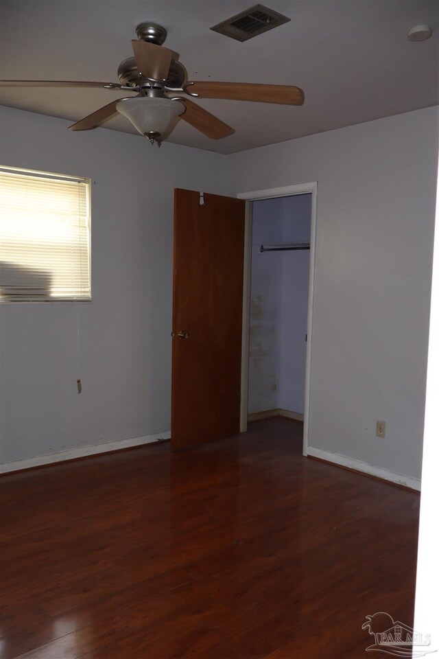 unfurnished bedroom featuring a closet, ceiling fan, and hardwood / wood-style floors