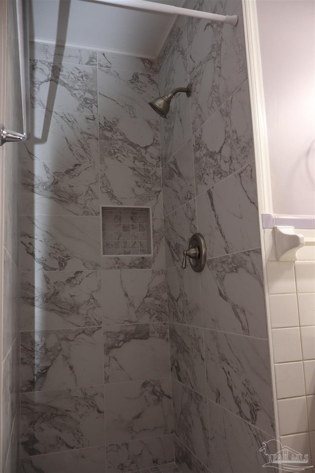 bathroom with a tile shower