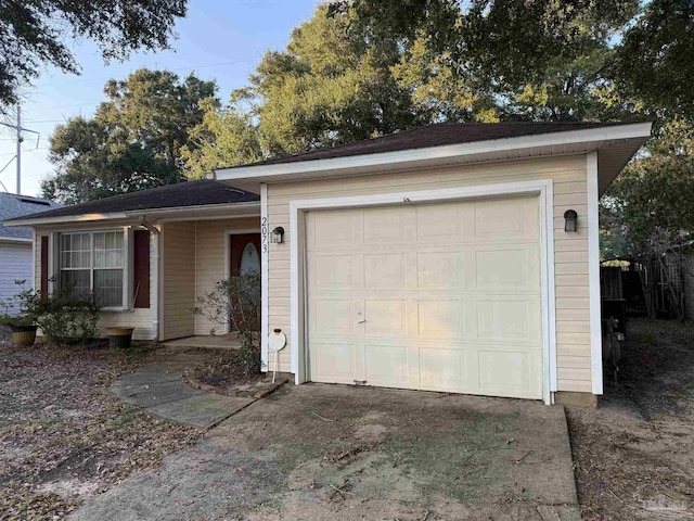 single story home with a garage