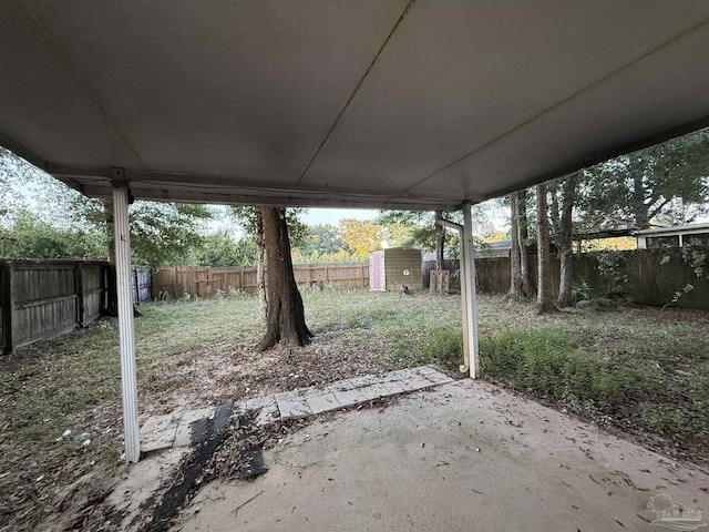 view of patio featuring a shed