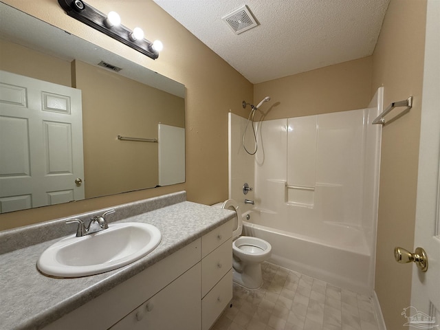 full bathroom featuring vanity, toilet, shower / bath combination, and a textured ceiling