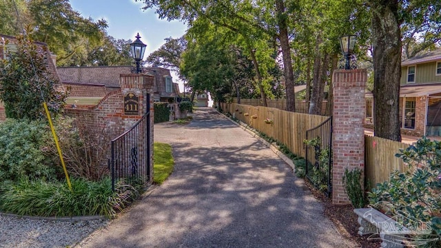 view of gate with fence