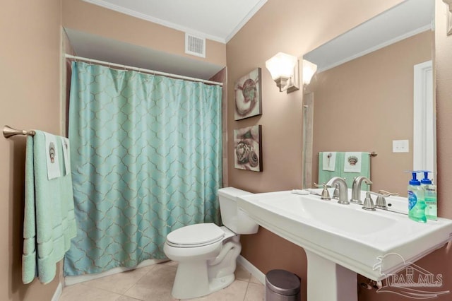 full bathroom with visible vents, toilet, tile patterned flooring, crown molding, and a sink