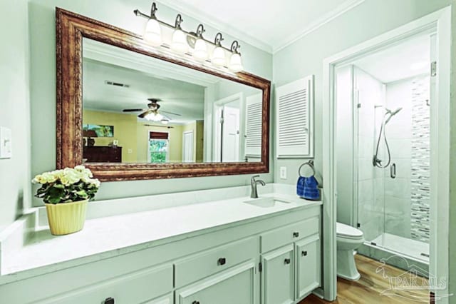 full bath featuring crown molding, visible vents, toilet, a stall shower, and vanity