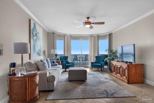 tiled living room with ornamental molding, floor to ceiling windows, and ceiling fan