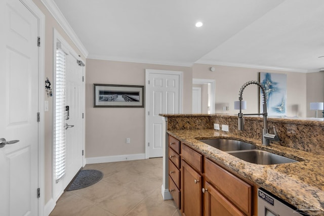 kitchen with light stone counters, sink, crown molding, and light tile patterned flooring