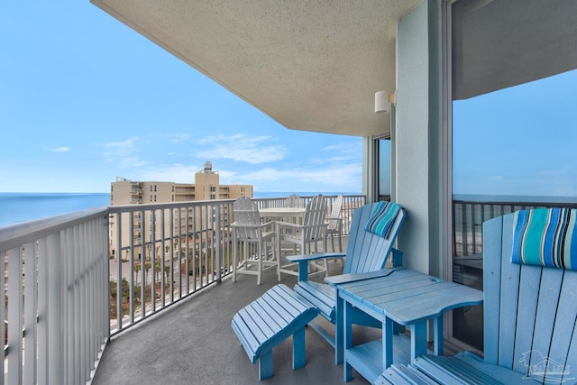 balcony featuring a water view