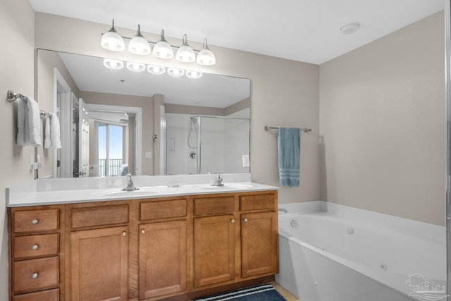 bathroom featuring independent shower and bath and vanity