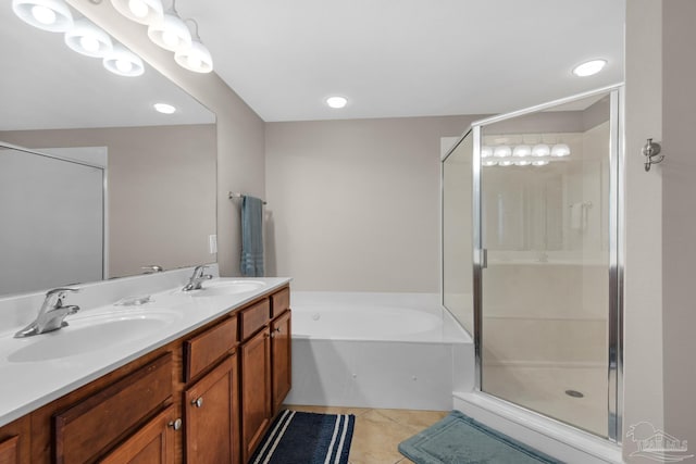 bathroom with vanity, tile patterned floors, and separate shower and tub