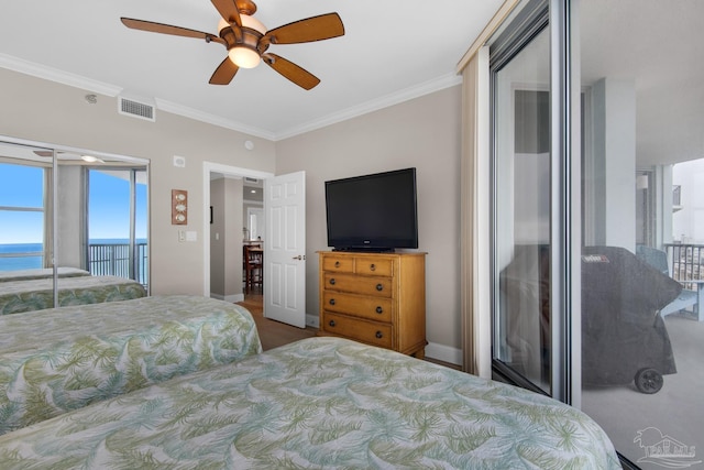 bedroom featuring access to exterior, crown molding, ceiling fan, and a water view