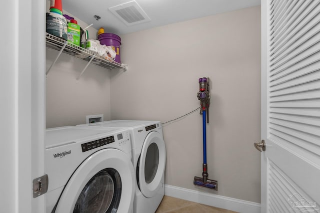 laundry area with independent washer and dryer