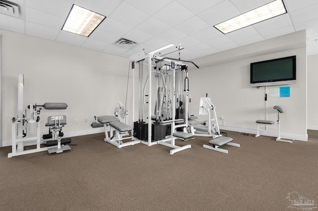 gym featuring a paneled ceiling