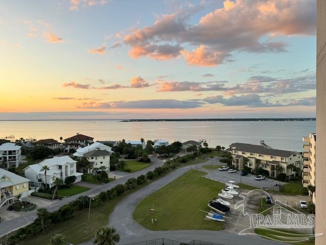 aerial view at dusk with a water view