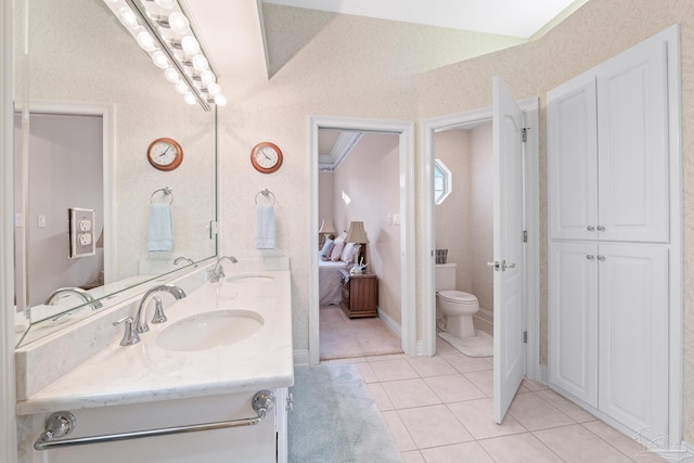 bathroom with tile patterned floors, toilet, and vanity