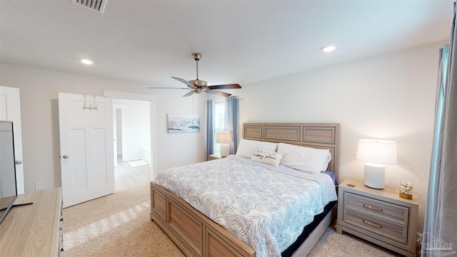 bedroom with ceiling fan and light colored carpet