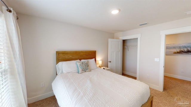 bedroom featuring carpet and a closet