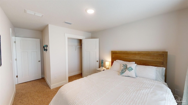 carpeted bedroom with a closet