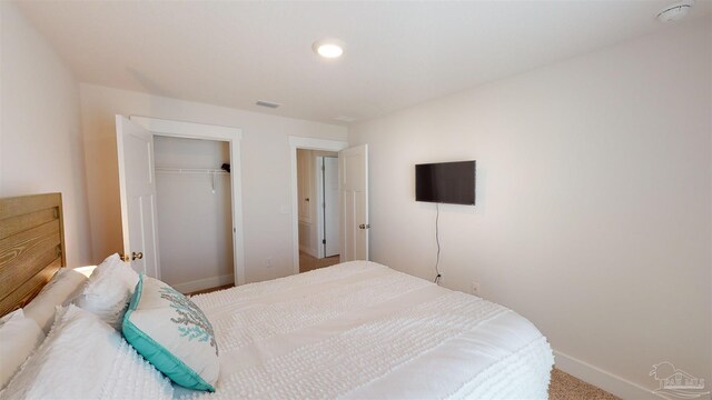 carpeted bedroom featuring a closet