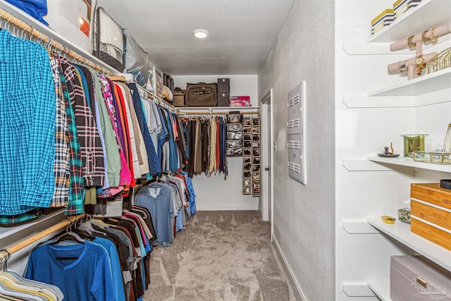 spacious closet with carpet floors