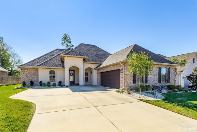 view of front facade with a front lawn and a garage