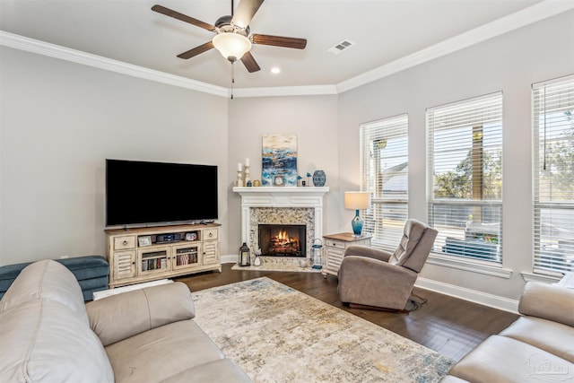 living room with ceiling fan, dark wood-type flooring, and ornamental molding