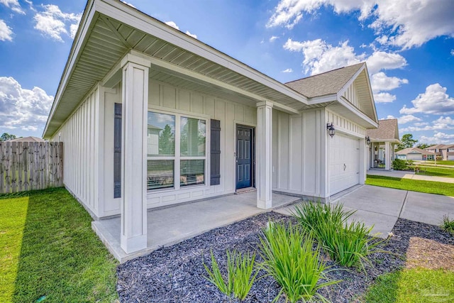 view of front of house with a front lawn and a garage