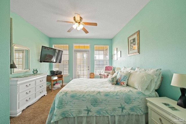 bedroom with ceiling fan and carpet