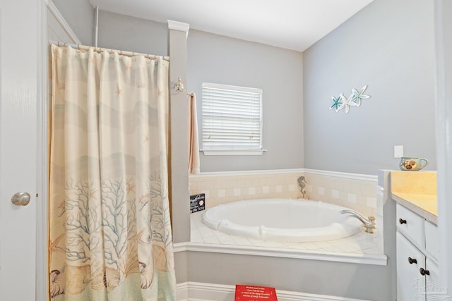 bathroom with vanity and a tub