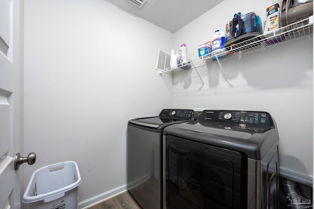 4616 Honor Guard Way, Crestview, FL 32539 - laundry room featuring washer and clothes dryer and dark wood-type flooring