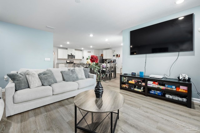 4616 Honor Guard Way, Crestview, FL 32539 - living room with light wood-style floors and recessed lighting