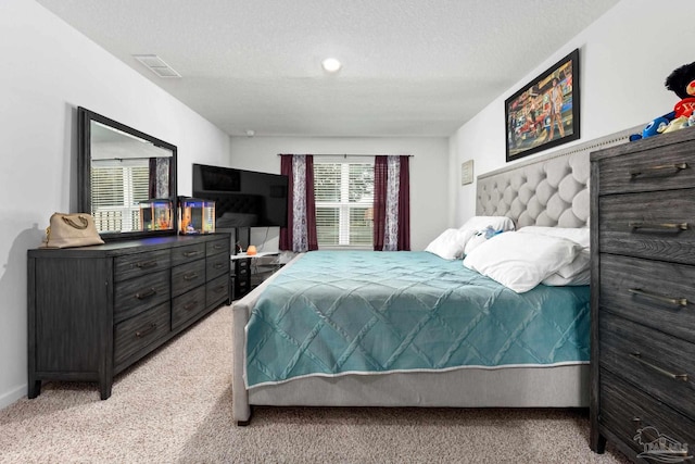 4616 Honor Guard Way, Crestview, FL 32539 - carpeted bedroom with a textured ceiling