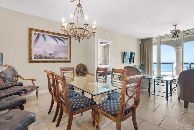 dining space featuring light tile patterned floors and ceiling fan with notable chandelier