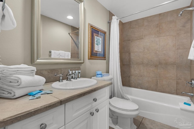 full bathroom with shower / bath combo, vanity, toilet, and tile patterned floors