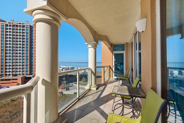 balcony featuring a water view