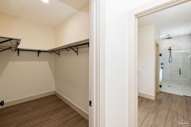 spacious closet with visible vents and wood finished floors