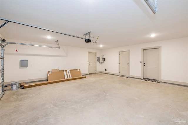 garage featuring baseboards and a garage door opener