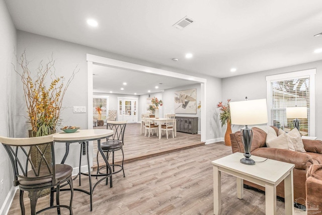 living room with light hardwood / wood-style floors