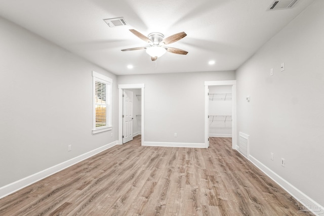 spare room featuring ceiling fan and light hardwood / wood-style flooring