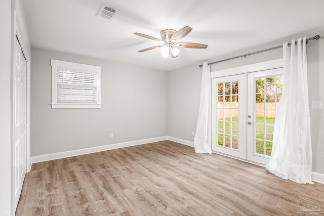 spare room with french doors, light hardwood / wood-style flooring, and ceiling fan