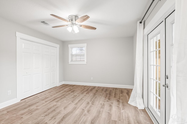 unfurnished bedroom with ceiling fan, a closet, and light hardwood / wood-style flooring