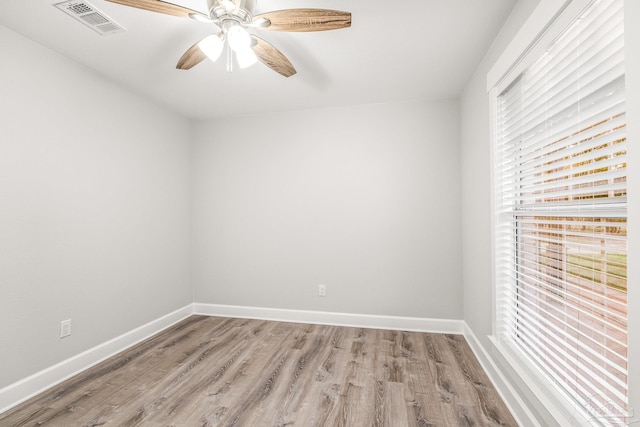 unfurnished room featuring light wood-type flooring and ceiling fan