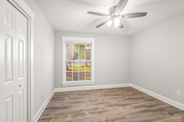 empty room featuring hardwood / wood-style floors and ceiling fan