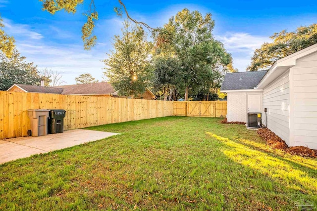 view of yard featuring a patio area and cooling unit