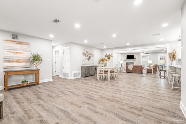 unfurnished living room with light hardwood / wood-style floors and ceiling fan