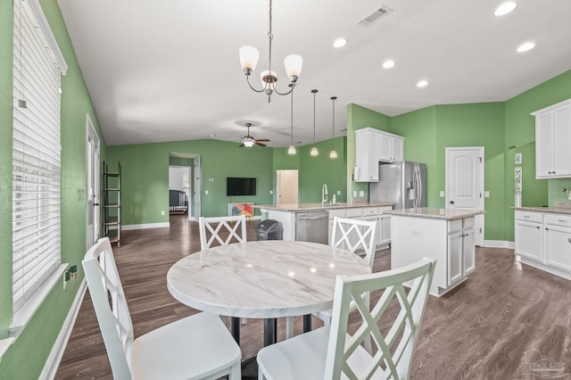 dining space with ceiling fan with notable chandelier, recessed lighting, baseboards, dark wood-type flooring, and visible vents