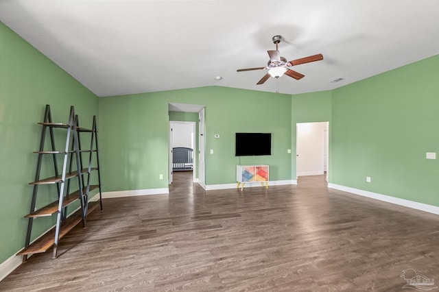 unfurnished living room with ceiling fan, visible vents, wood finished floors, baseboards, and lofted ceiling